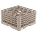 A beige plastic Vollrath Traex rack with 20 compartments.