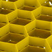 A yellow Vollrath Traex glass rack with an open rack extender on top.