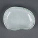 A white opal glass eliptical dish with a small hole in the middle.