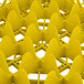 A Vollrath yellow plastic tray with 25 compartments and holes.
