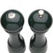 Two green Chef Specialties salt and pepper shakers.