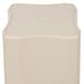 A beige square plastic container with a square top.