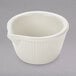 A white fluted Tuxton ramekin with a curved rim.