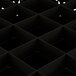 A black square Vollrath glass rack with holes.