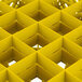 A yellow Vollrath Traex glass rack with 25 small squares.