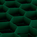 A close up of a green rectangular object with a hexagonal grid.