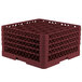 A large red plastic Vollrath Traex glass rack with holes.