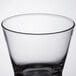 An Arcoroc Shetland rocks glass with a black rim on a white background.