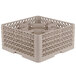 A beige plastic Vollrath Traex glass rack with 30 compartments.