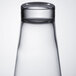 An Arcoroc Shetland highball glass filled with a clear liquid.