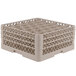 A beige plastic Vollrath Traex glass rack with 30 compartments.