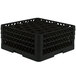 A black Vollrath Traex rack for 30 glasses with holes in it.