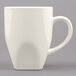 A white Tuxton Bistro China mug with a handle.