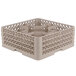 A beige plastic Vollrath Traex glass rack with 30 compartments.