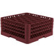 A red Vollrath Traex glass rack with small compartments.