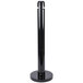 A black cylindrical Rubbermaid cigarette receptacle with a round base.