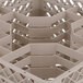 A beige plastic Vollrath Traex glass rack with 30 compartments.