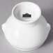 A white bowl with lion head accents.