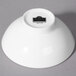 A white bowl with a black label on it.