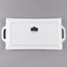 A white rectangular porcelain platter with handles.