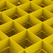 A yellow Vollrath Traex glass rack with many square compartments.