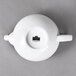 A 10 Strawberry Street Whittier white porcelain teapot with a lid and a handle.