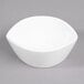 A 10 Strawberry Street Whittier white porcelain leaf bowl on a gray surface.