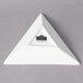 A white triangle shaped porcelain tid bit tray.