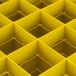 A yellow Vollrath Traex grid with black borders and holes.