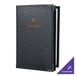 A black leather Menu Solutions Royal Select menu cover.