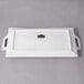 A white rectangular porcelain platter with handles.