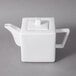A 10 Strawberry Street Whittier white porcelain teapot with a lid.
