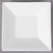 A white porcelain square tray with a small square cut out.