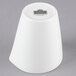 A white porcelain milk cup with a label.