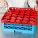 a red and blue rack with empty glasses