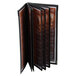 A black leather-like Menu Solutions booklet with four pages open.
