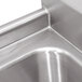 A stainless steel Advance Tabco three compartment sink with right drainboard.