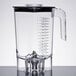 A clear polycarbonate container with a handle for a Hamilton Beach blender.