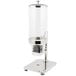 A Vollrath glass cereal dispenser canister on a metal stand.