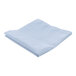 A folded light blue Intedge cloth table cover on a white surface.