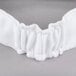 A white elastic Headsweats headband.