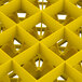 A yellow Vollrath Traex glass rack grid with many square compartments.
