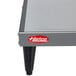 A Hatco heated shelf on a stainless steel table.