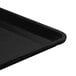 A close-up of a black Cambro dietary tray.
