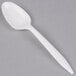 a white spoon on a gray surface