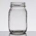 An American Metalcraft clear glass mason jar with a white lid on a table.