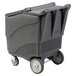 A grey plastic Follett ice storage bin with wheels.