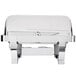 A silver Vollrath Orion Retractable Chafer with a lid.