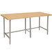 An Advance Tabco wood top work table with a stainless steel base.
