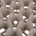 A close-up of a beige plastic tray with compartments.